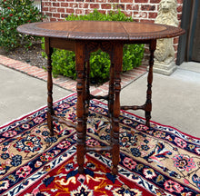 Load image into Gallery viewer, Antique English Table Drop Leaf Gateleg Turned Post Carved Top Oak Oval