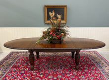 Load image into Gallery viewer, Antique English Butterfly Leaf Oval Carved Dining Table 118" Tiger Oak c1920-30s