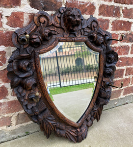 Antique English Mirror Renaissance Revival Oak Frame Shield Shape Lion Wood Back