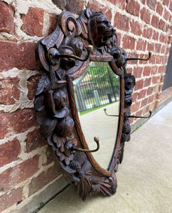 Antique English Mirror Renaissance Revival Oak Frame Shield Shape Lion Wood Back