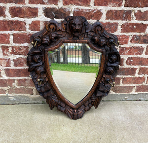 Antique English Mirror Renaissance Revival Oak Frame Shield Shape Lion Wood Back