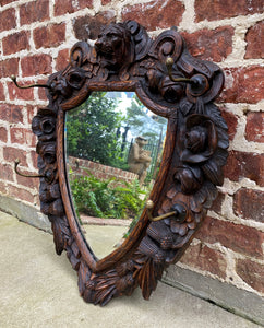 Antique English Mirror Renaissance Revival Oak Frame Shield Shape Lion Wood Back