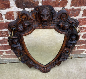 Antique English Mirror Renaissance Revival Oak Frame Shield Shape Lion Wood Back