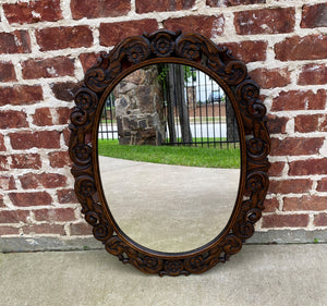 antique oval wood mirror