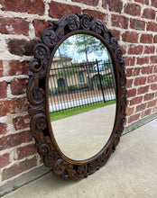 Load image into Gallery viewer, Antique English Mirror OVAL Carved Oak Frame Wood Back Edwardian Era