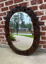 Load image into Gallery viewer, Antique English Mirror OVAL Carved Oak Frame Wood Back Edwardian Era
