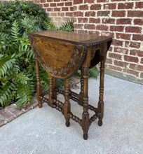 Load image into Gallery viewer, Antique English Table Drop Leaf Gate Leg Carved Top Oval PETITE Oak c. 1920s