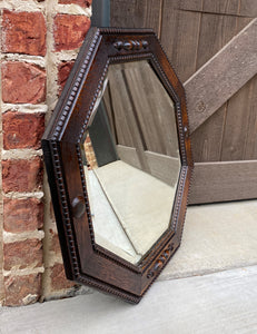 Antique English Mirror Jacobean Carved Oak Framed Beveled Mirror Octagonal 1930s