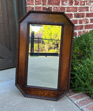 Load image into Gallery viewer, Antique English Mirror Jacobean Carved Oak Framed Beveled Mirror Octagonal 1930s